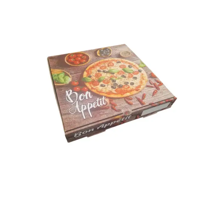 A closed pizza box featuring a pizza and vegetables, with "Bon Appetit" in white script, showcases the 1kg Bacon Pizza Topping. The box is set against a plain white background.