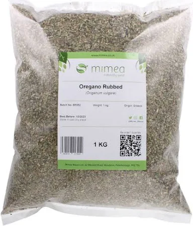 A 1kg bag of rubbed oregano in a clear plastic package, labeled "Rubbed Oregano (1kg Bag)" with product details on a white and green label.